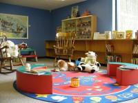Photo of a children&#039;s play room with toys and a play mat